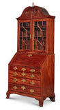 VERY FINE AND RARE CHIPPENDALE CARVED AND FIGURED MAHOGANY DESK-AND-BOOKCASE