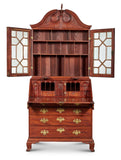 VERY FINE AND RARE CHIPPENDALE CARVED AND FIGURED MAHOGANY DESK-AND-BOOKCASE